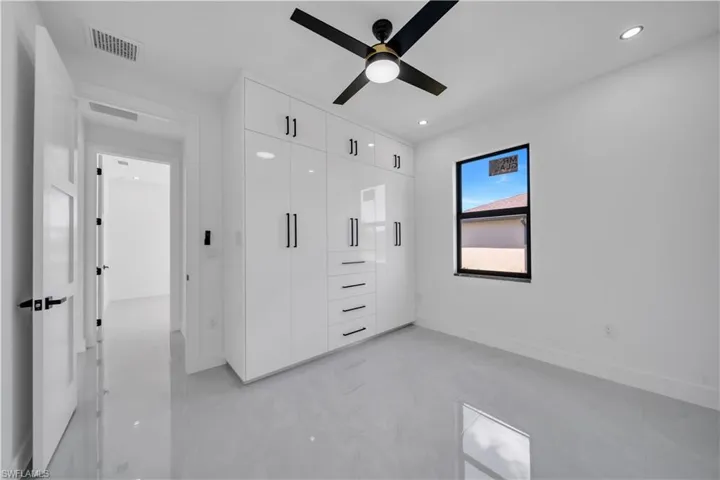 Unfurnished bedroom with a closet, recessed lighting, and a ceiling fan
