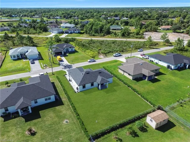View of property location with nearby suburban area
