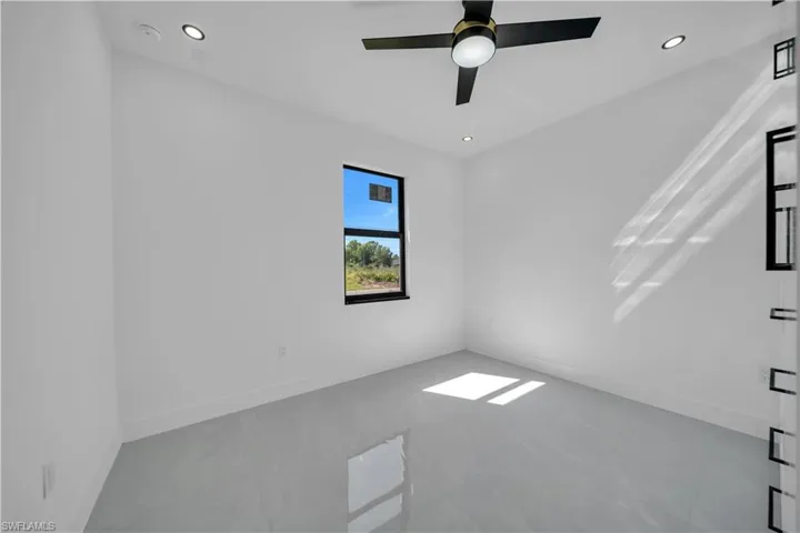 Unfurnished room with recessed lighting and ceiling fan