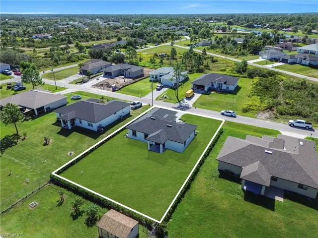 View of property location with nearby suburban area