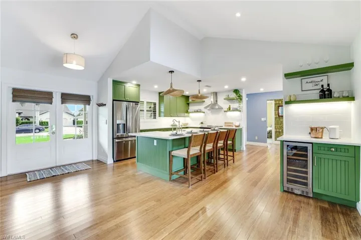 Newly remodeled kitchen with ample cabinetry and quartz counters