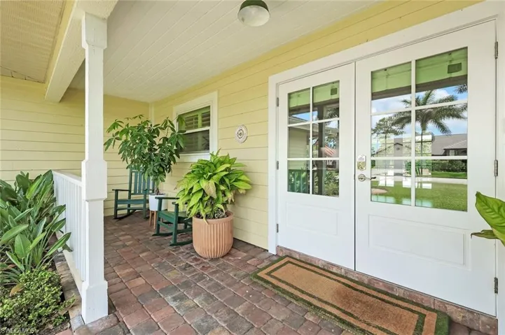 Charming covered front porch and impact-resistant double front doors
