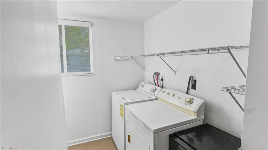 Laundry room featuring independent washer and dryer