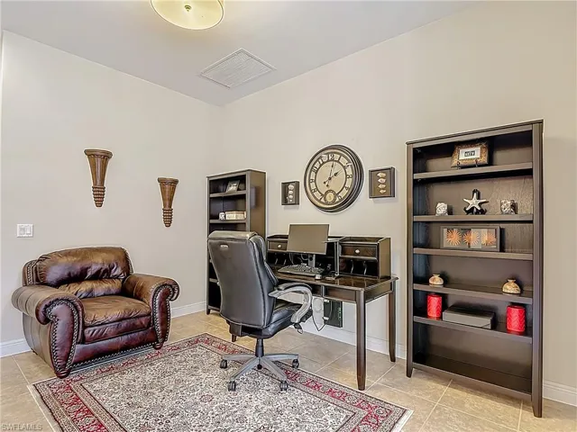 Office area with light tile patterned flooring