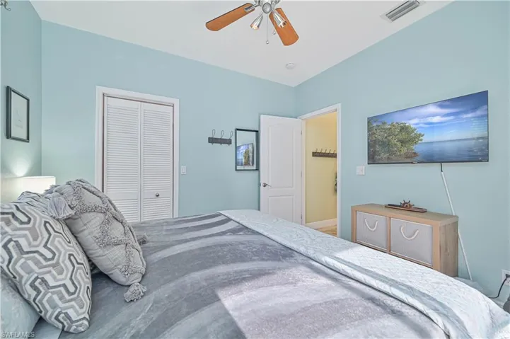 Bedroom with a closet and ceiling fan