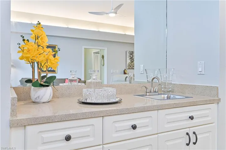Bathroom featuring vanity and a ceiling fan