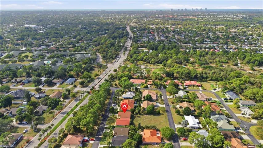 Aerial overview of property's location with nearby suburban area