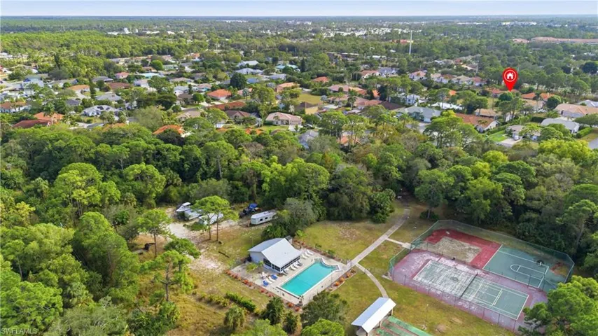 Aerial view of property's location with a pool