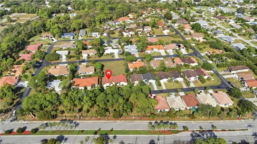 Aerial overview of property's location featuring nearby suburban area