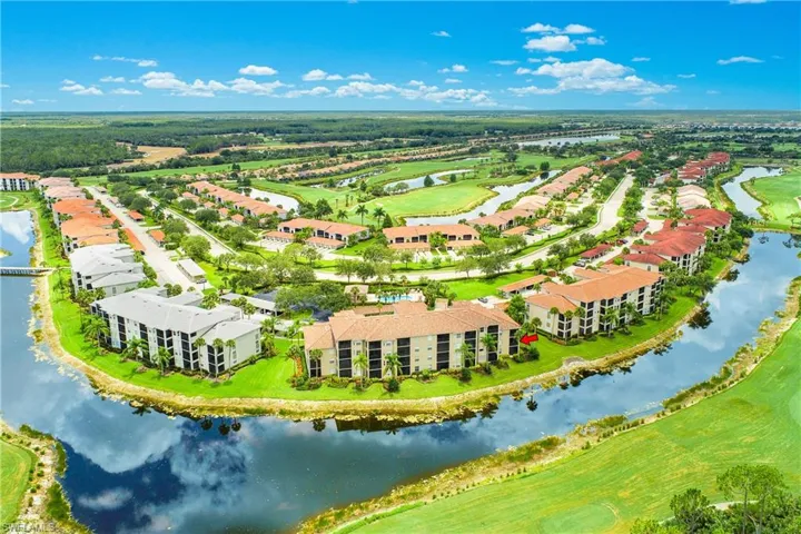 Birds eye view of property featuring a water, golf course and preserve view.