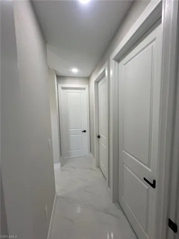 Corridor with light tile floors