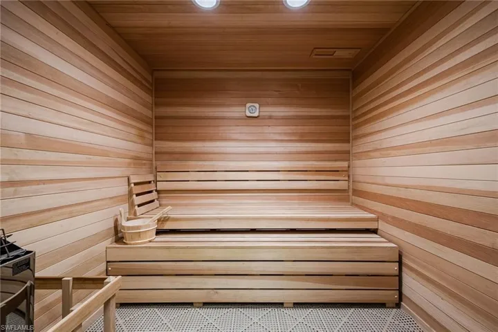 Relaxing sauna / steam room with wood walls and wooden ceiling