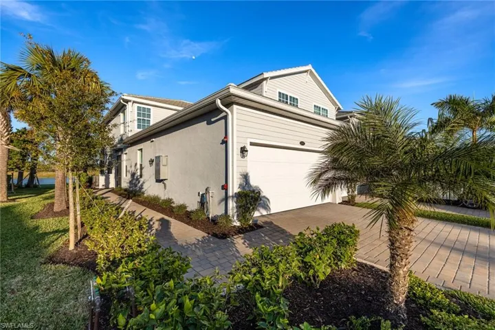 Side view of condo with pathway to front entrance