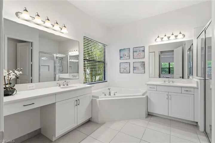Primary Bathroom with 2 sink, shower, bath tub
