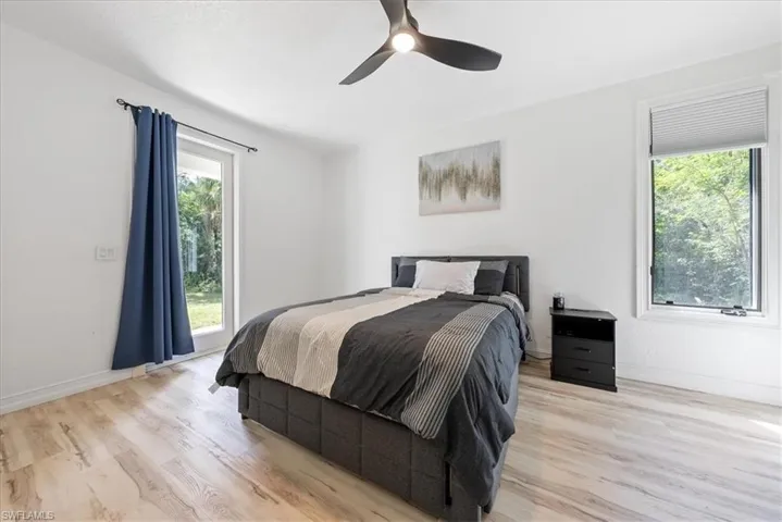 Bedroom featuring a ceiling fan and light wood finished floors