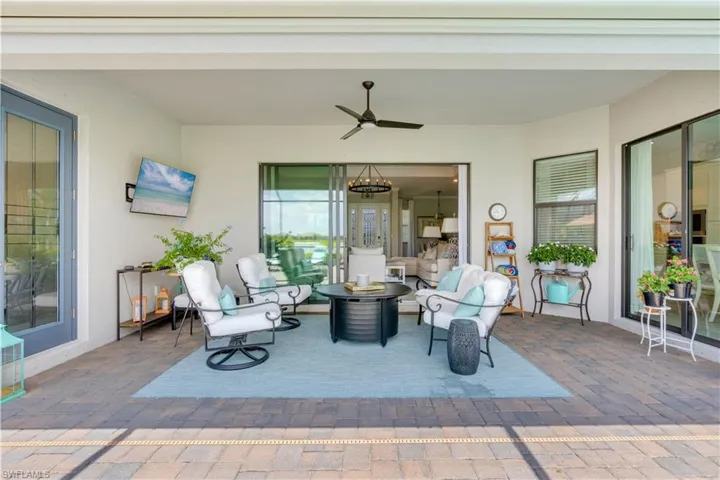 View of patio featuring ceiling fan