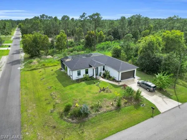 View from above of property with a heavily wooded area