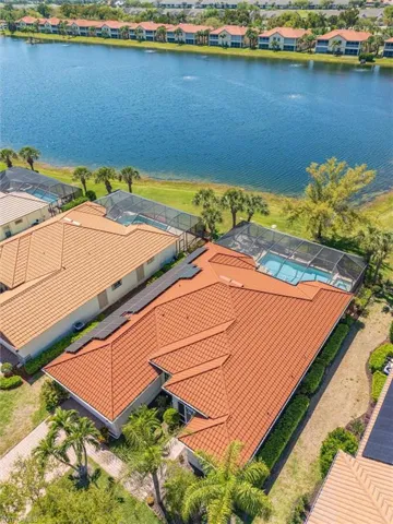 Aerial perspective of suburban area with a large body of water