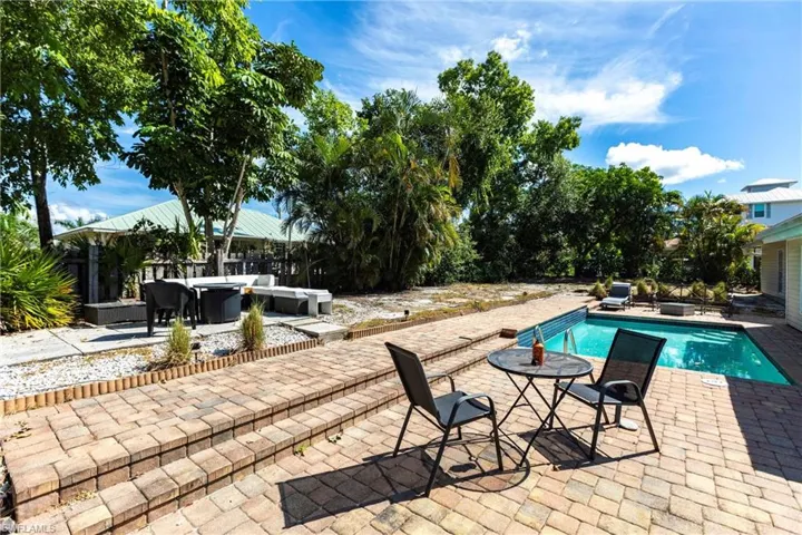 Outdoor pool featuring a patio