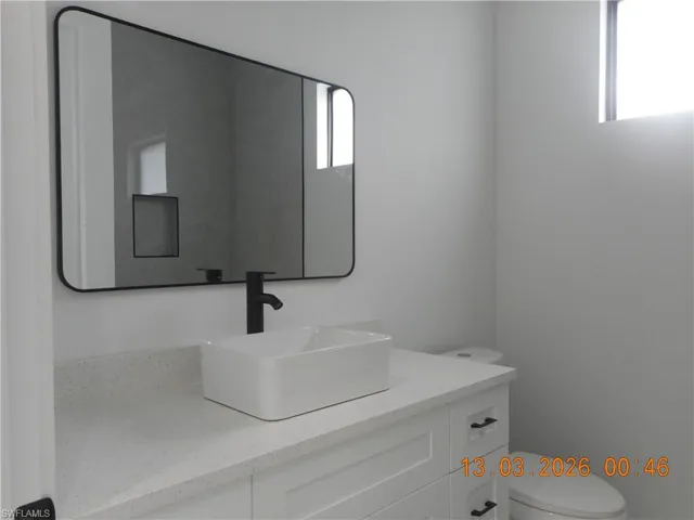 Bathroom with vanity and healthy amount of natural light