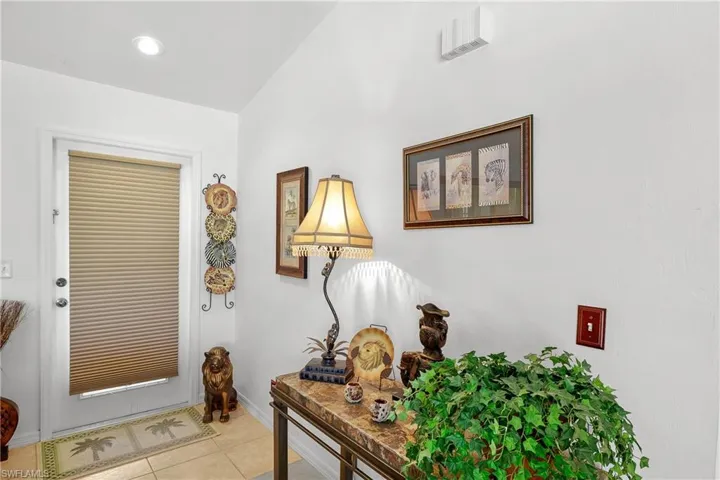 Entrance foyer featuring light tile floors