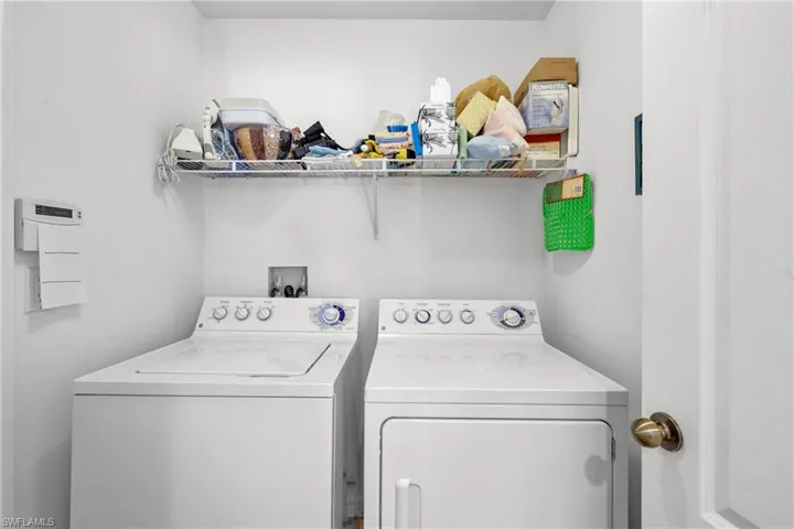 Washroom featuring washer and clothes dryer and hookup for a washing machine
