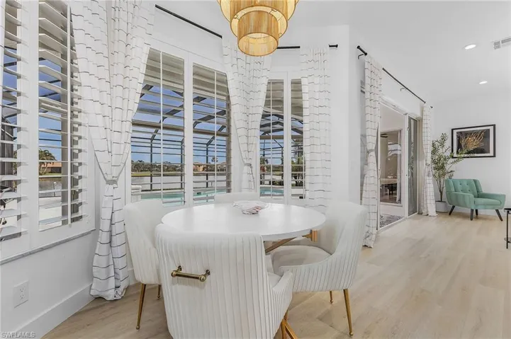 Dining area with light hardwood / wood-style floors