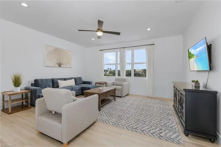 Secondary Living room featuring light wood-type flooring and ceiling fan