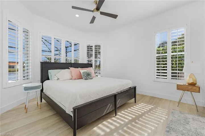 Primary Bedroom featuring ceiling fan and light hardwood / wood-style floors