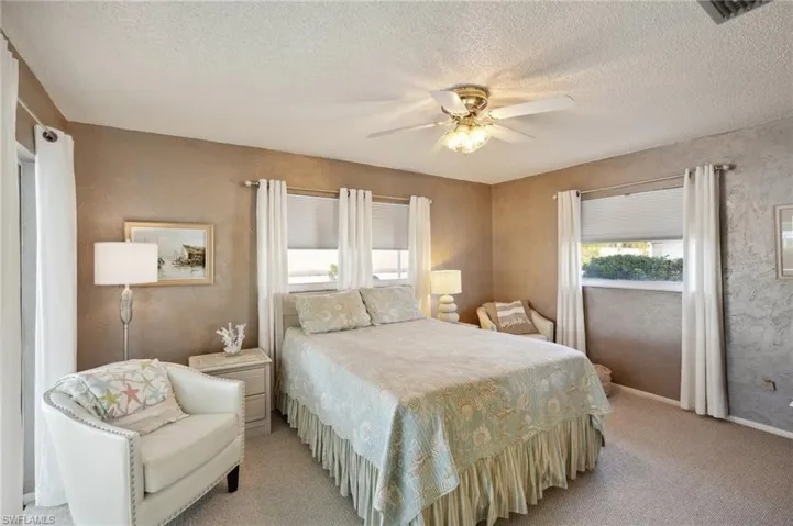 Primary Suite with slider access to Screened Lanai