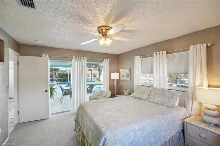Primary Suite with slider access to Screened Lanai