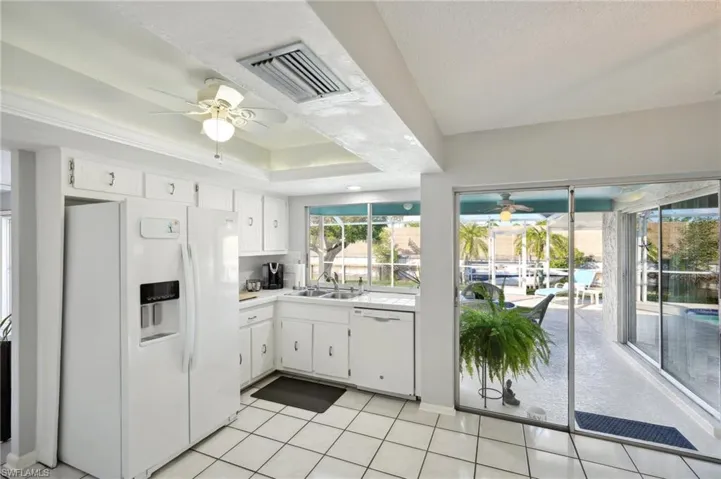Kitchen & Dining Area with Sliders accesses Covered Lanai Dining and sitting areas