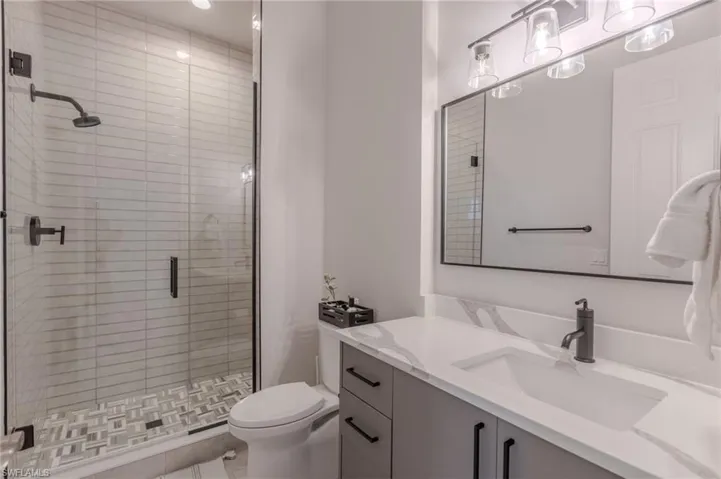 2nd ensuite bathroom boast a beautiful walk in shower and quartz