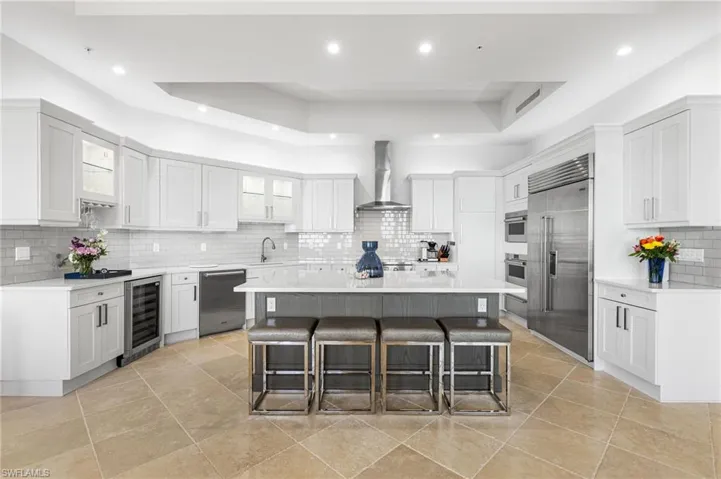 The state-of-the-art WOLF kitchen is a chef’s dream, boasting an induction range, steam oven with convection, Sub-Zero refrigerator and freezer, new Cove dishwasher, warming drawer, and a wine fridge—ideal for entertaining.
