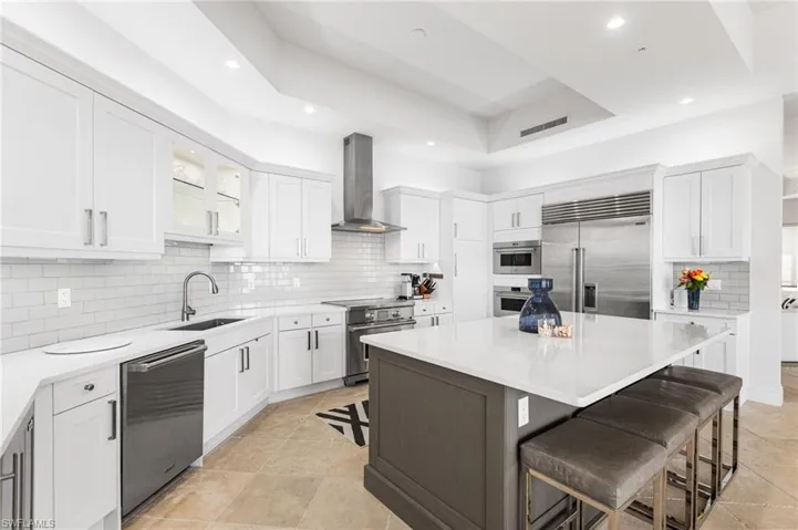Subway tile backsplash, underlighting, uplighting.Custom cabinetry. Quartz countertops. Tray ceilings.