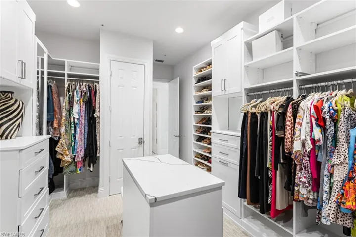 Oversized custom walk in closet in your primary suite is so big it should have it's own zip code! Spacious island and built ins!