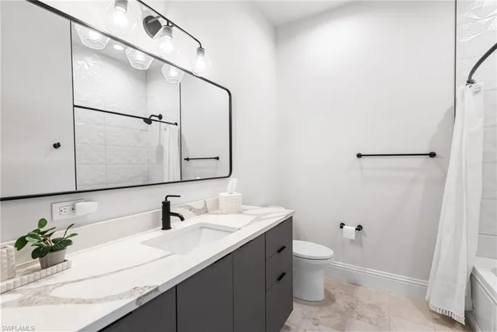 3rd ensuite bath offers a shower/tub combination. Gorgeous quartz countertop!