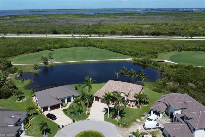 Aerial view of a large body of water and a local golf course