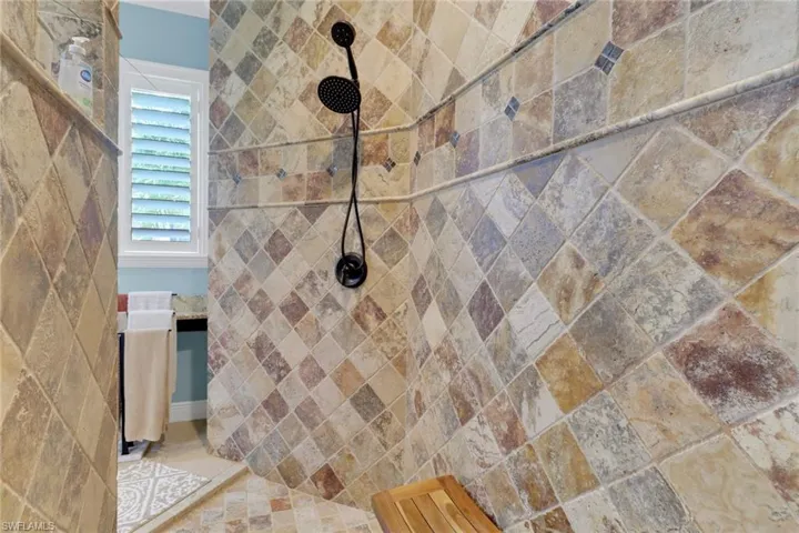 Full bathroom featuring tiled shower