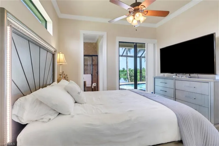 Bedroom featuring access to exterior, crown molding, and ceiling fan