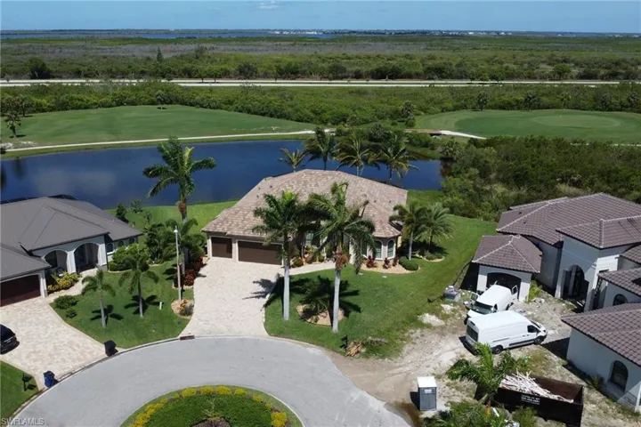Aerial view of a large body of water and a golf course
