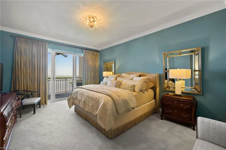Spacious primary bedroom with lanai access.