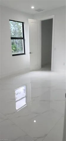 View of spare room with walk in closet