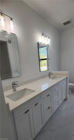 Master Bathroom featuring vanity and toilet