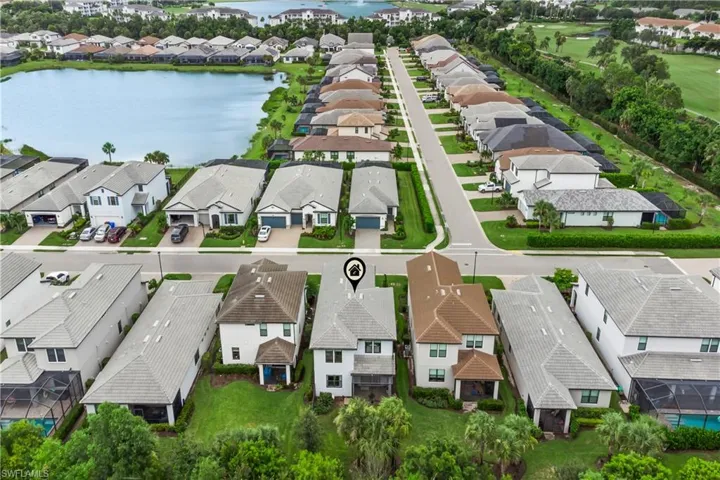 Aerial view of residential area with a large body of water