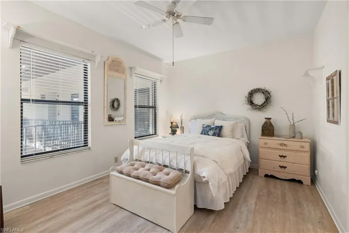 Bedroom featuring ceiling fan and light hardwood / wood-style flooring