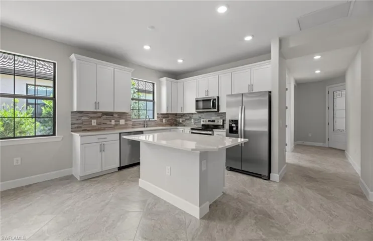Completed home with kitchen island, quartz countertops, stainless steel appliances, and more!