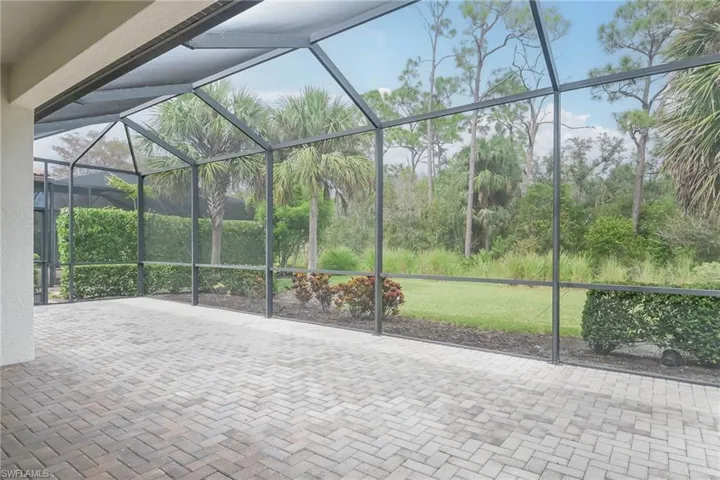 View of patio / terrace with a lanai