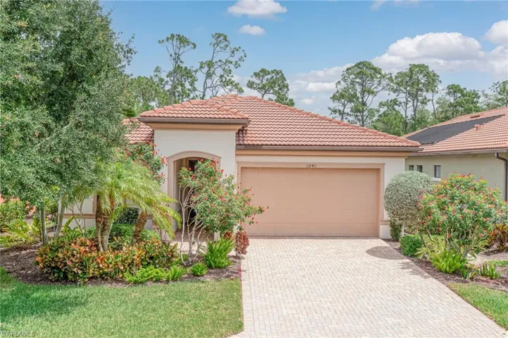 Mediterranean / spanish-style house with a garage