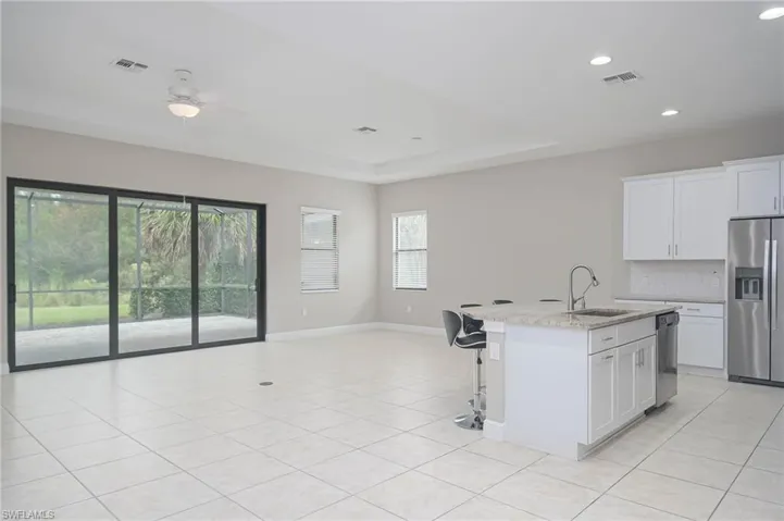 Large Open Area - Living Room/ Dining Room/ Kitchen with white cabinets